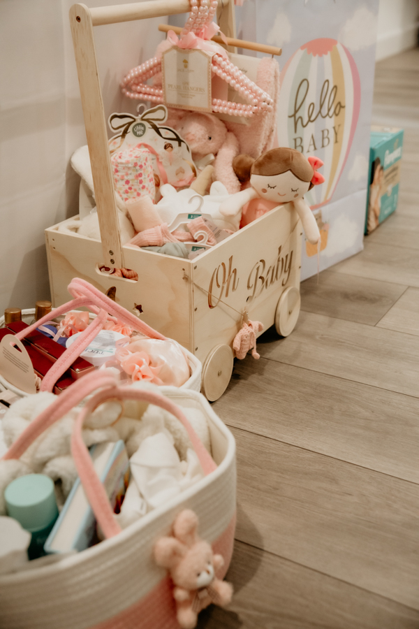 6G4A5258 Close-up of baby shower gifts and baby themed details.