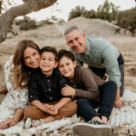 " Natural light holiday family portrait of mom, dad, and two young brothers photographed by a Los Angeles and Santa Clarita family photographer"